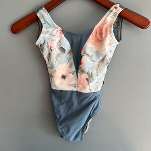Lucky Leo floral on blue leotard with mesh V cut chest